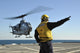 AH-1W Super Cobra Helicopter taking off from USS Ponce poster print