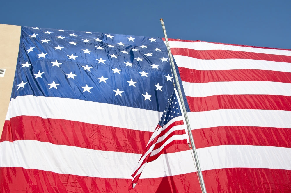 American flag poster print over headquarters building in Afghanistan