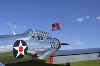 BT-13 Valiant trainer aircraft poster print featuring American flag.