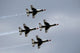 United States Air Force Thunderbirds flying in diamond formation over Lakeland, Florida.
