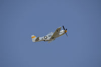 P-51 Mustang in flight poster print showcasing aviation art.