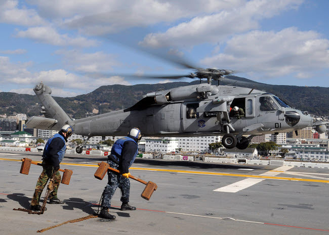 MH-60S Sea Hawk Helicopter Poster Print showcasing airmen preparing the aircraft.