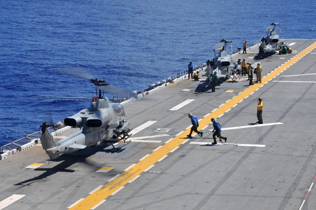 AH-1Z Super Cobra helicopters landing on USS Essex poster print