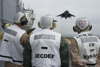 March 30, 2012 poster print of Secretary of Defense Leon E. Panetta visiting USS Peleliu in the Pacific Ocean.