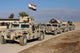 Iraqi Army soldiers aboard M1114 humvee vehicles poster print