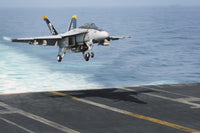 F/A-18F Super Hornet landing on USS Dwight D. Eisenhower poster print.