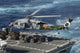 MH-60S Sea Hawk helicopter picking up supplies from USNS Bridge over the Pacific Ocean.