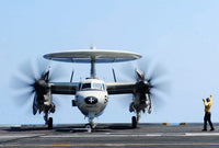 Aviation Boatswain's Mate directing an E-2C Hawkeye on the flight deck poster print.