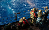 Sailors firing M240 machine guns aboard USS John C. Stennis poster print.