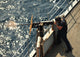 Seaman firing a 50-caliber machine gun aboard USS Gunston Hall poster print