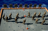 Marines firing rounds at targets aboard USS Bonhomme Richard poster print.
