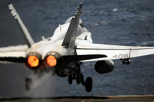 F/A-18C Hornet launching from USS Abraham Lincoln poster print