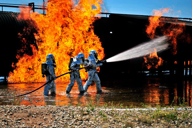 Firefighters extinguishing a simulated engine fire at Cannon Air Force Base poster print.