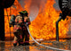 Firefighters battling a blaze at a mock aircraft - Poster Print
