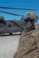 US Army soldier loading a CH-47 Chinook helicopter poster print.