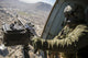 Czech Air Force door gunner scanning for threats from Mil Mi-17 helicopter in Afghanistan.