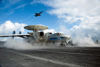 F/A-18C Hornet flying with E-2C Hawkeye preparing to launch poster print.