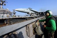 Aviation Boatswain's Mate launching F/A-18C Hornet from USS John C. Stennis poster print.