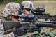 Marines and sailors waiting for a CH-53E Super Stallion to land poster print.