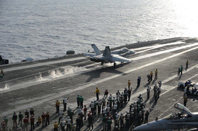 F/A-18C Hornet launching from USS Dwight D. Eisenhower poster print.