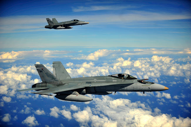 Two Royal Australian Air Force F/A-18 Hornets Poster Print showcasing military aviation.