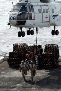 Poster print of Marines deploying from SA-330J Puma helicopter