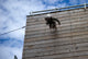 US Soldier running down a 40-foot rappelling wall poster print.