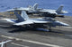 F/A-18C Hornet landing on USS George H.W. Bush aircraft carrier poster print.