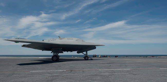 X-47B Unmanned Combat Air System launching from USS George HW Bush poster print.
