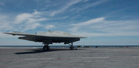 X-47B Unmanned Combat Air System launching from USS George HW Bush poster print.