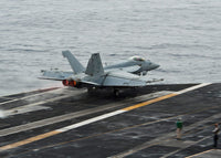 F/A-18E Super Hornet launching from USS Nimitz poster print.