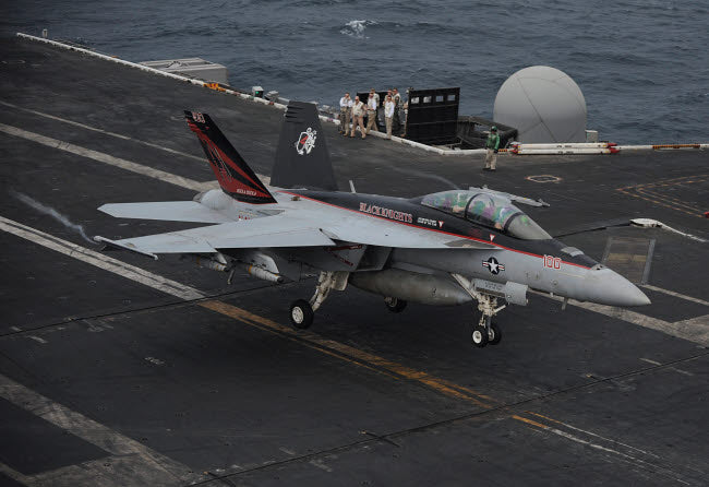 F/A-18F Super Hornet landing on USS Nimitz flight deck poster print.