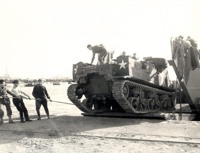 US Army M7 Howitzer Motor Carrier Unloading in Algiers Poster Print