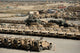 Rows of heavy vehicles and supplies at Camp Warrior poster print