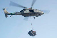 MH-60S Knighthawk delivering cargo poster print