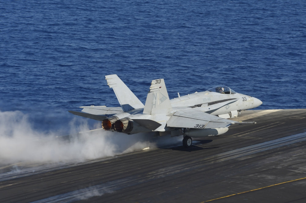 F/A-18C Hornet launching from aircraft carrier USS Nimitz poster print.
