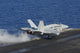 F/A-18C Hornet launching from aircraft carrier USS Nimitz poster print.