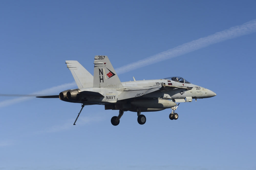 F/A-18C Hornet flying over USS Nimitz in the Mediterranean Sea poster print