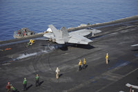 F/A-18E Super Hornet launching from USS Nimitz aircraft carrier poster print.