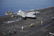F/A-18E Super Hornet launching from USS Nimitz aircraft carrier poster print.