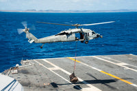 MH-60S Sea Hawk delivering supplies to USS George Washington poster print