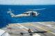 MH-60S Sea Hawk delivering supplies to USS George Washington poster print