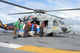 MH-60S Seahawk poster print featuring sailors loading fresh water.