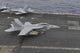 F/A-18F Super Hornet landing on USS Nimitz flight deck in South China Sea.