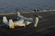 MV-22 Osprey receiving cargo on USS Harry S Truman poster print