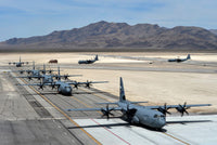 Seven C-130J Super Hercules aircraft taxiing at Creech Air Force Base poster print.