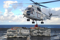Sailors attaching cargo legs to SA330J Puma helicopter poster print