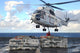 Sailors attaching cargo legs to SA330J Puma helicopter poster print