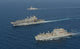 USNS Robert E Peary conducts a vertical replenishment with USS Bataan poster print.