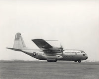 YC-130 First Flight Poster Print by Stocktrek Images showcasing the aircraft's inaugural flight.